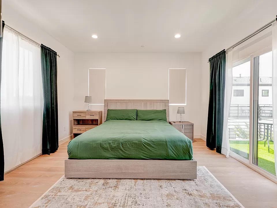 Bright private bedroom with large bed and natural light